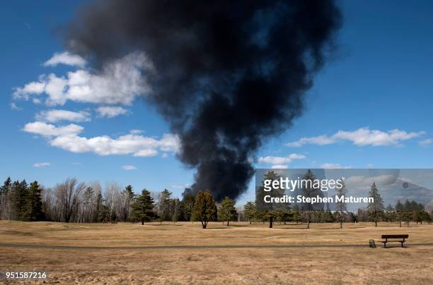 Smoke rises from a fire at the Husky Oil Refinery behind an empty golf course on April 26, 2018 in Superior, Wisconsin. Evacuations have been ordered...
