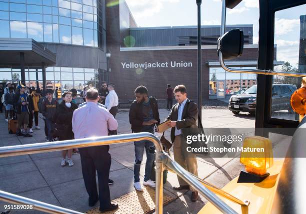 Students at the University of Wisconsin-Superior line up to load busses on April 26, 2018 in Superior, Wisconsin. The campus is being evacuated after...