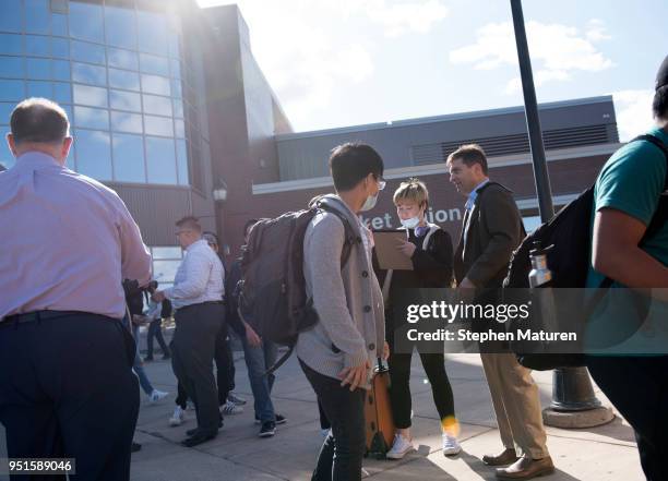 Students at the University of Wisconsin-Superior line up to load busses on April 26, 2018 in Superior, Wisconsin. The campus is being evacuated after...