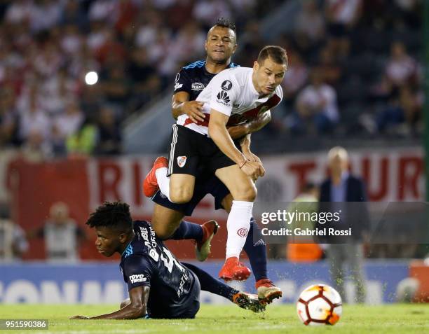 Rodrigo Mora of River Plate fights for the ball with Fernando Pinillo and of Emelec during a match between River Plate and Emelec as part of Copa...