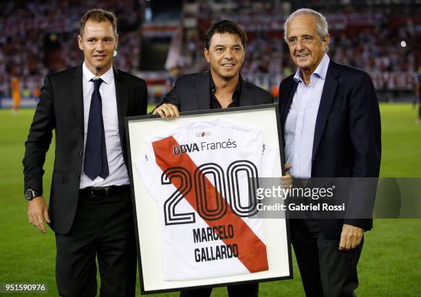 Marcelo Gallardo coach of River Plate reaceives a jersey to celebrate his 200th match from Roldolfo D'Onofrio President of River Plate prior a match...