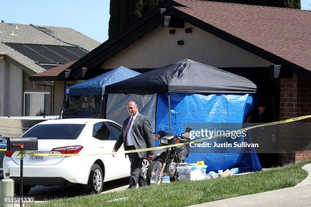 Law enforcement officials leave the home of accused rapist and killer Joseph James DeAngelo on April 24, 2018 in Citrus Heights, California....
