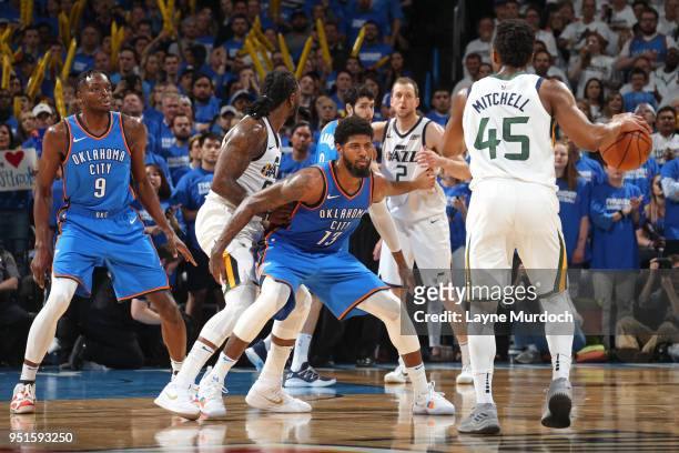 Paul George of the Oklahoma City Thunder plays defense as Donovan Mitchell of the Utah Jazz handles the ball in Game Five of Round One of the 2018...