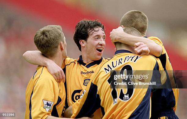 Liverpool players Michael Owen, Robbie Fowler, Danny Murphy, and Steven Gerrard celebrate as another goal goes in during the FA Carling Premiership...