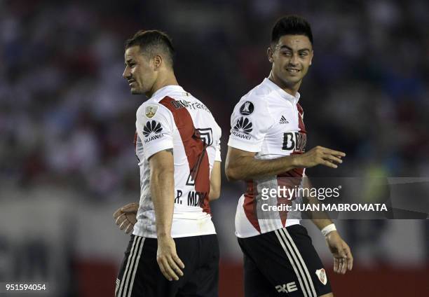 Argentina's River Plate forward Rodrigo Mora reacts after missing a chance to score against Ecuador's Emelec next to teammate midfielder Gonzalo...