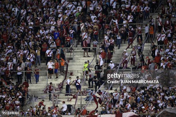 Argentina's River Plate supporters cheer for their team during the Copa Libertadores 2018 group D football match against Ecuador's Emelec at the...