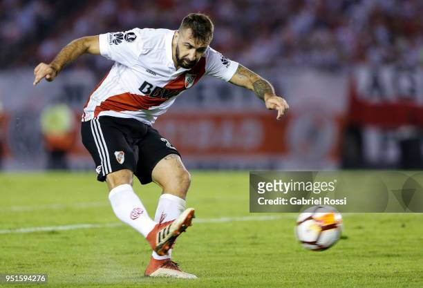 Lucas Pratto of River Plate kicks the ball to score the first goal of his team during a match between River Plate and Emelec as part of Copa CONMEBOL...