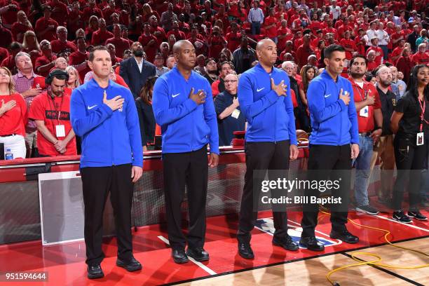 Referee officials Zach Zarba, Brian Forte, Sean Wright, and Karl Lane stand during the national anthem before the game between Minnesota Timberwolves...