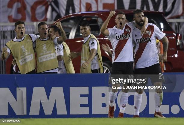 Argentina's River Plate forward Lucas Pratto celebrates with teammate forward Rafael Borre after scoring a goal against Ecuador's Emelec during the...