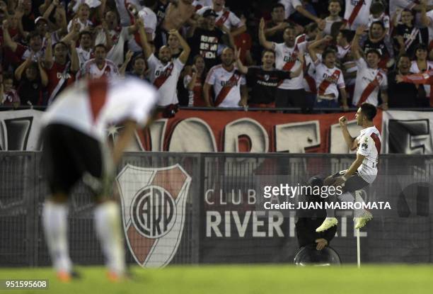 Argentina's River Plate midfielder Gonzalo Martinez celebrates after scoring the team's second goal against Ecuador's Emelec during the Copa...