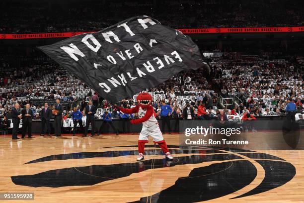 Toronto Raptors mascot waves flag before the game against the Washington Wizards in Game Five of the Eastern Conference Quarterfinals during the 2018...