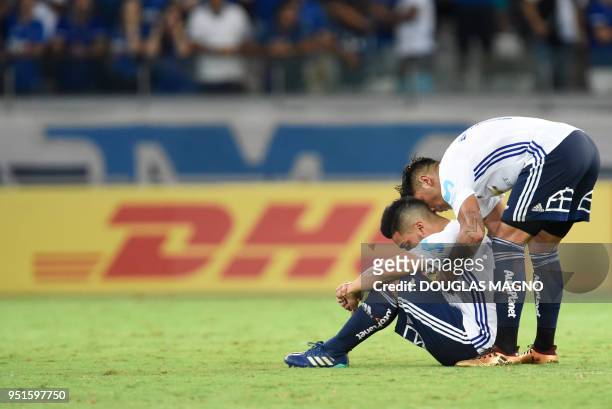 Lorenzo Reyes and Gonzalo Jara of Chile's Universidad de Chile are pictured after losing 7-0 to Brazilian team Cruzeiro in a Copa Libertadores...