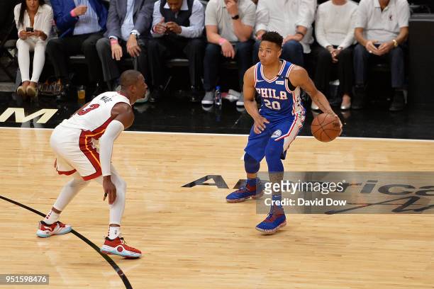 Markelle Fultz of the Philadelphia 76ers handles the ball against Dwyane Wade of the Miami Heat in Game Three of Round One of the 2018 NBA Playoffs...