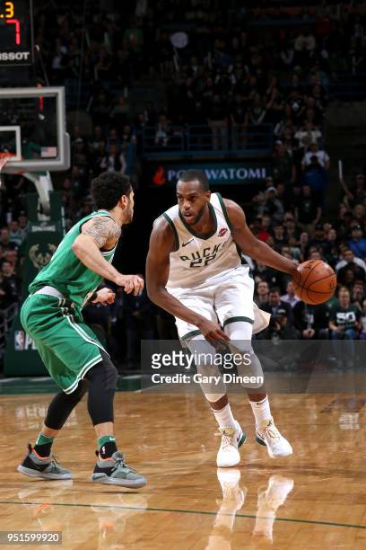 Khris Middleton of the Milwaukee Bucks handles the ball against the Boston Celtics in Game Six of the Round One of the 2018 NBA Playoffs on April 26,...
