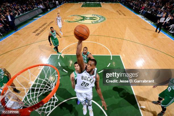 Khris Middleton of the Milwaukee Bucks goes up for a dunk against the Boston Celtics in Game Six of Round One of the 2018 NBA Playoffs on April 26,...