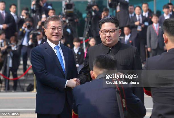 South Korean President Moon Jae-in, left, and North Korean leader Kim Jong Un pose for a photograph as they meet at the truce village of Panmunjom in...