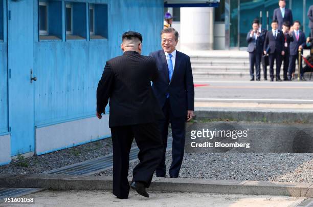 South Korean President Moon Jae-in, right, and North Korean leader Kim Jong Un meet at the border in truce village of Panmunjom in the Demilitarized...