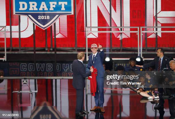 Josh Rosen of UCLA poses with NFL Commissioner Roger Goodell after being picked overall by the Arizona Cardinals during the first round of the 2018...