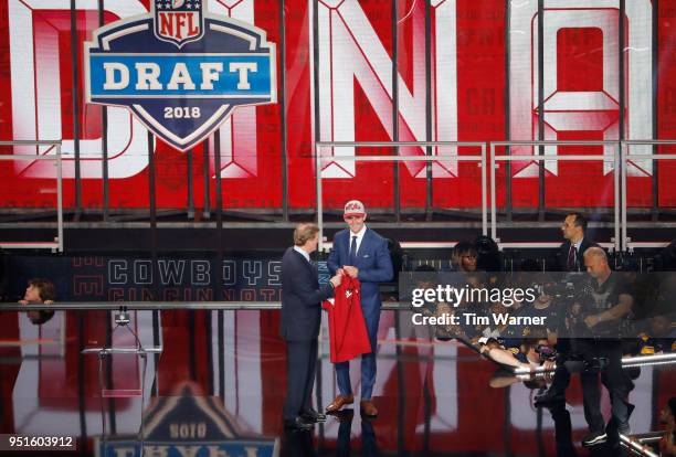 Josh Rosen of UCLA poses with NFL Commissioner Roger Goodell after being picked overall by the Arizona Cardinals during the first round of the 2018...