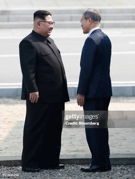 South Korean President Moon Jae-in, right, and North Korean leader Kim Jong Un meet at the border in the truce village of Panmunjom in the...