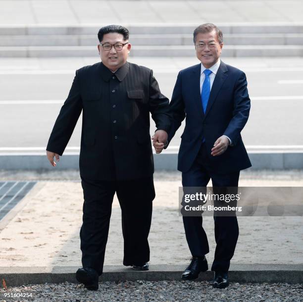 South Korean President Moon Jae-in, right, and North Korean leader Kim Jong Un walk together as they meet in the truce village of Panmunjom in the...