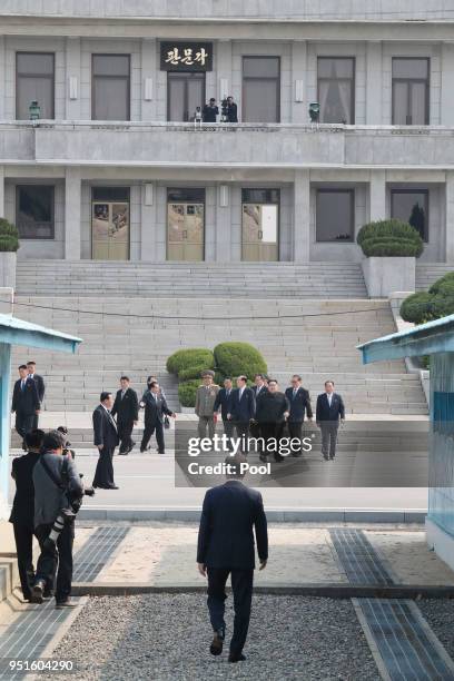 North Korean leader Kim Jong Un arrives as South Korean President Moon Jae-in awaits near the military demarcation line for the Inter-Korean Summit...