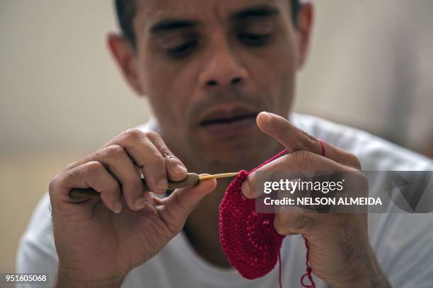 An inmate crochets clothing as part of "Ponto Firme" project in the Adriano Marrey maximum security penitentiary in Guarulhos, Brazil on April 25,...