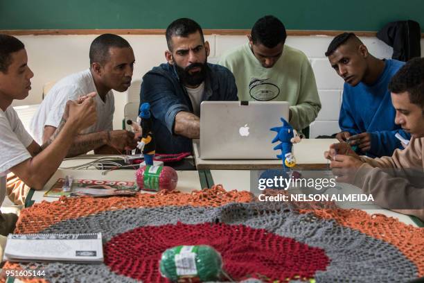 Brazilian designer and craftsman Gustavo Silvestre teaches crochet to inmates as part of "Ponto Firme" project in the Adriano Marrey maximum security...