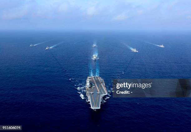 This photo taken on April 18, 2018 shows China's sole operational aircraft carrier, the Liaoning , sailing during a drill at sea. / China OUT