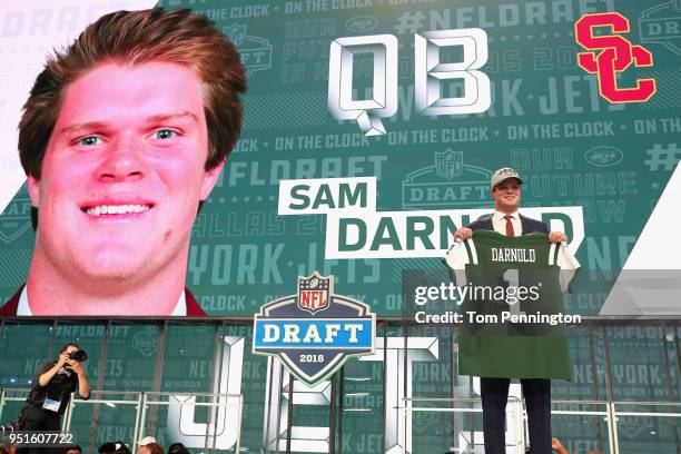 Sam Darnold of USC poses after being picked overall by the New York Jets during the first round of the 2018 NFL Draft at AT&T Stadium on April 26,...