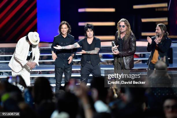 Carlos Santana and Juan Calleros, Alex Gonzalez, Fher Olvera and Sergio Vallin of Mana onstage at the 2018 Billboard Latin Music Awards at the...