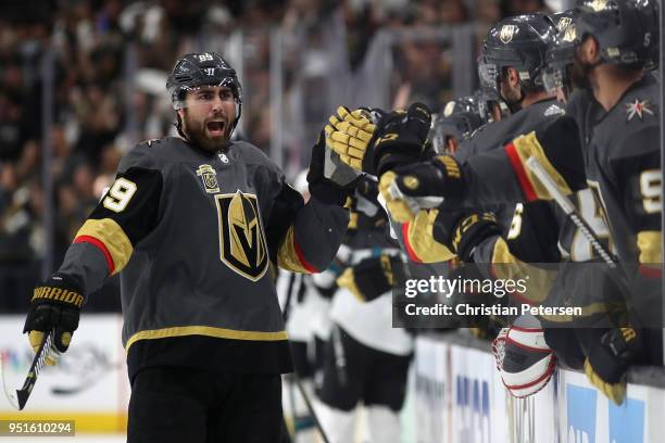 Alex Tuch of the Vegas Golden Knights celebrates with teammates on the bench after scoring a power-play goal against the San Jose Sharks in the first...