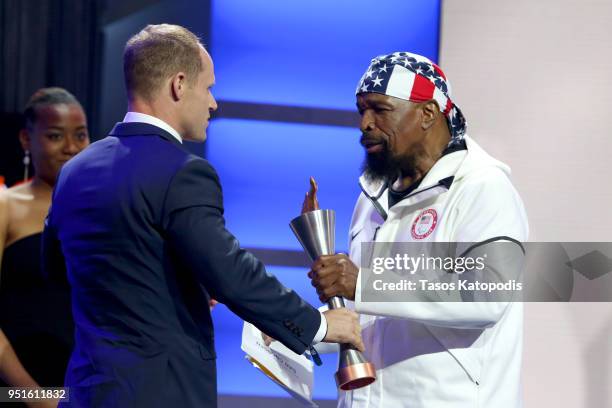 Dan Cnossen accepts the Male Paralympic Athlete of the Games award from Mr. T during the Team USA Awards at the Duke Ellington School of the Arts on...