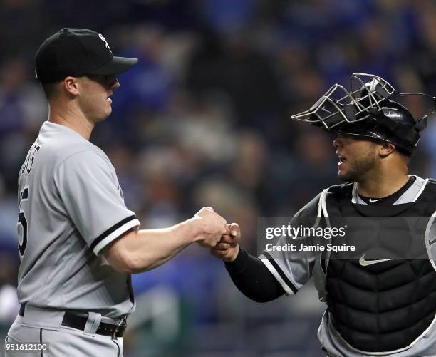 Nate Jones of the Chicago White Sox is congratulated by catcher Welington Castillo after escaping the 8th inning with the bases loaded during the...