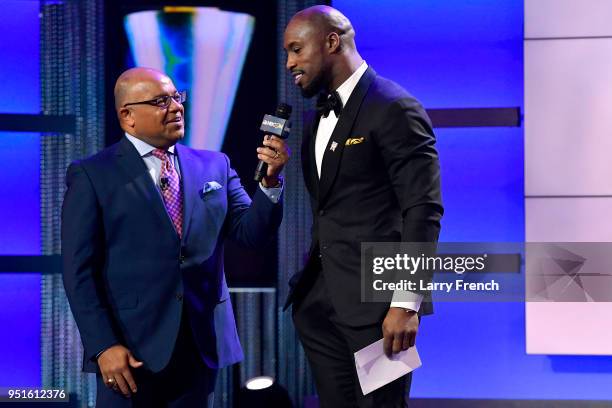 Mike Tirico and Vernon Davis speak onstage during the Team USA Awards at the Duke Ellington School of the Arts on April 26, 2018 in Washington, DC.