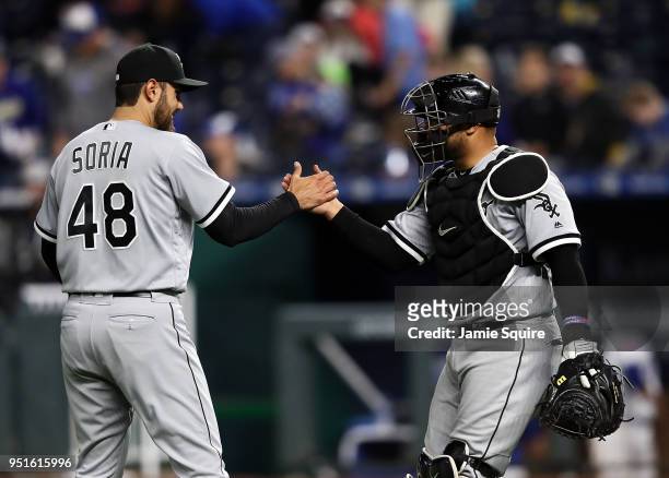 Joakim Soria and Welington Castillo of the Chicago White Sox congratulate each other after the White Sox defeated the Kansas City Royals 6-3- to win...