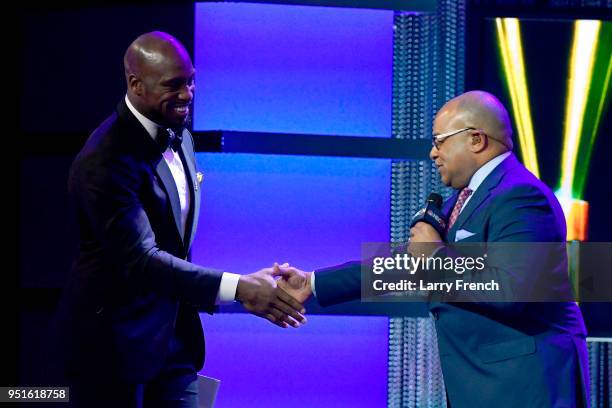 Vernon Davis and Mike Tirico speak onstage during the Team USA Awards at the Duke Ellington School of the Arts on April 26, 2018 in Washington, DC.