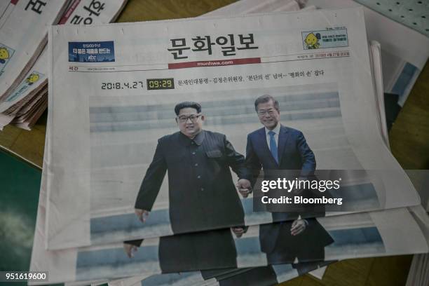 Copies of the Munhwa Ilbo Co. Newspaper, featuring a photograph of South Korean President Moon Jae-in, right, and North Korean leader Kim Jong Un...