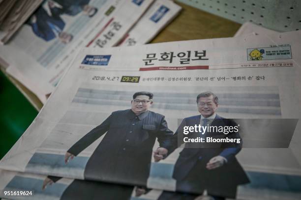Copies of the Munhwa Ilbo Co. Newspaper, featuring a photograph of South Korean President Moon Jae-in, right, and North Korean leader Kim Jong Un...