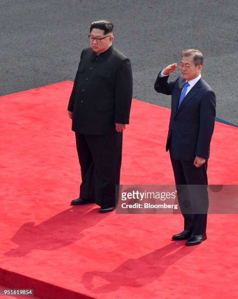 North Korean leader Kim Jong Un, left, stands next to South Korean President Moon Jae-in, as he salutes at the truce village of Panmunjom in the...