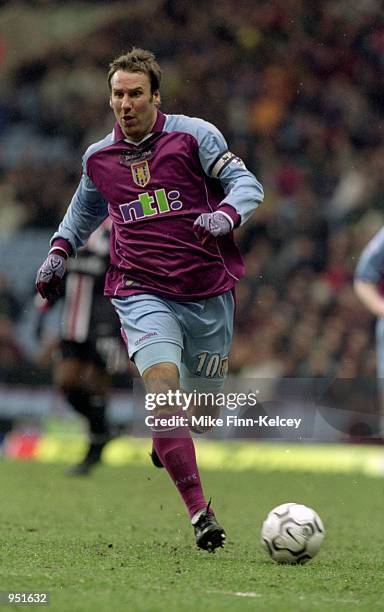 Paul Merson of Aston Villa runs with the ball during the FA Carling Premiership match against Middlesbrough played at Villa Park, in Birmingham,...