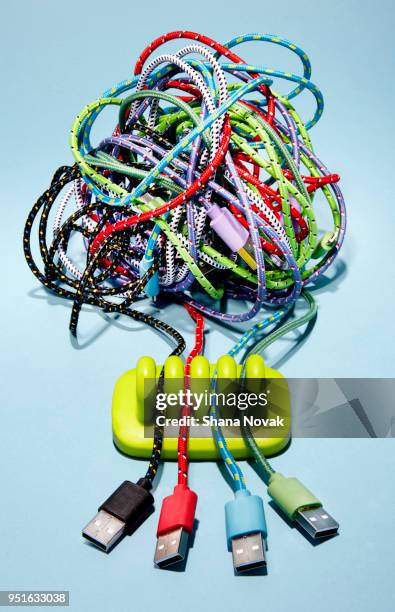 tangled device charger coords in an organizer - tangled stock pictures, royalty-free photos & images