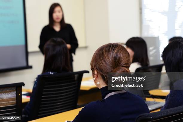 professional women attending seminar at work - japan training session stock pictures, royalty-free photos & images