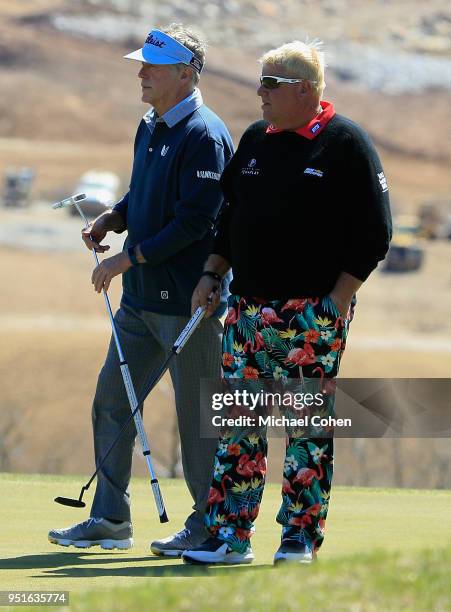 Michael Allen and partner John Daly look on during the first round of the PGA TOUR Champions Bass Pro Shops Legends of Golf held at Buffalo Ridge...