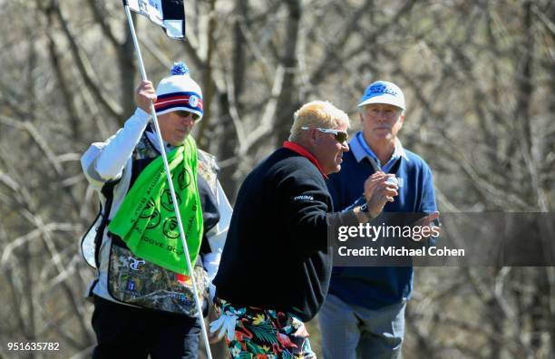 John Daly acknowledges the gallery as Michael Allen looks on during the first round of the PGA TOUR Champions Bass Pro Shops Legends of Golf held at...