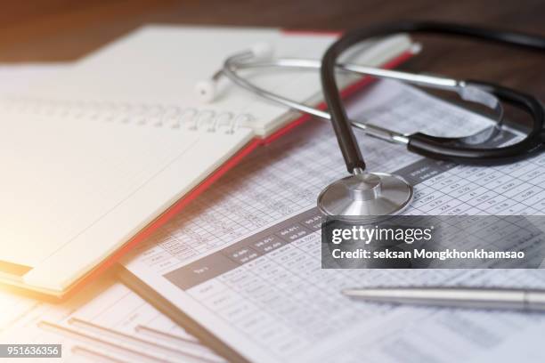 health care costs. stethoscope and calculator symbol - legislation stockfoto's en -beelden