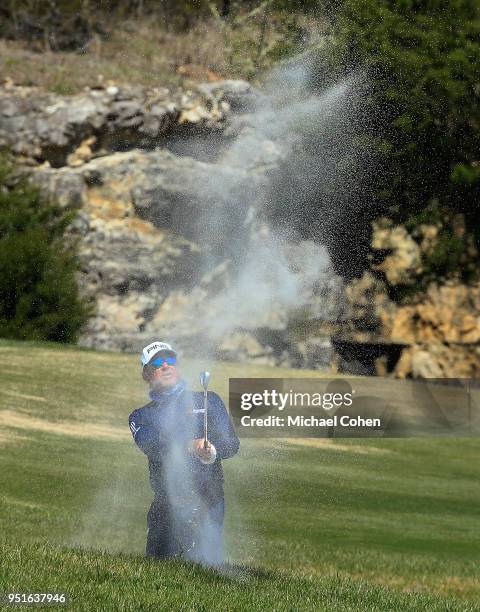 Miguel Angel Jimenez of Spain hits a bunker shot during the first round of the PGA TOUR Champions Bass Pro Shops Legends of Golf held at Buffalo...