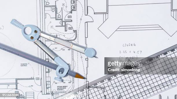 close-up of blueprint with ruler and drawing compass on table - floor plan stock pictures, royalty-free photos & images
