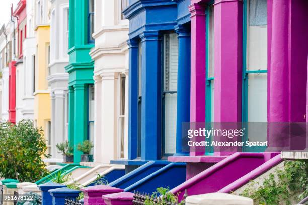 multi colored vibrant townhouses in notting hill, london, england, uk - notting hill street stock pictures, royalty-free photos & images