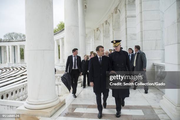 French President Emmanuel Macron walks with Maj Gen Michael Howard , commanding general, US Army Military District of Washington, through the...